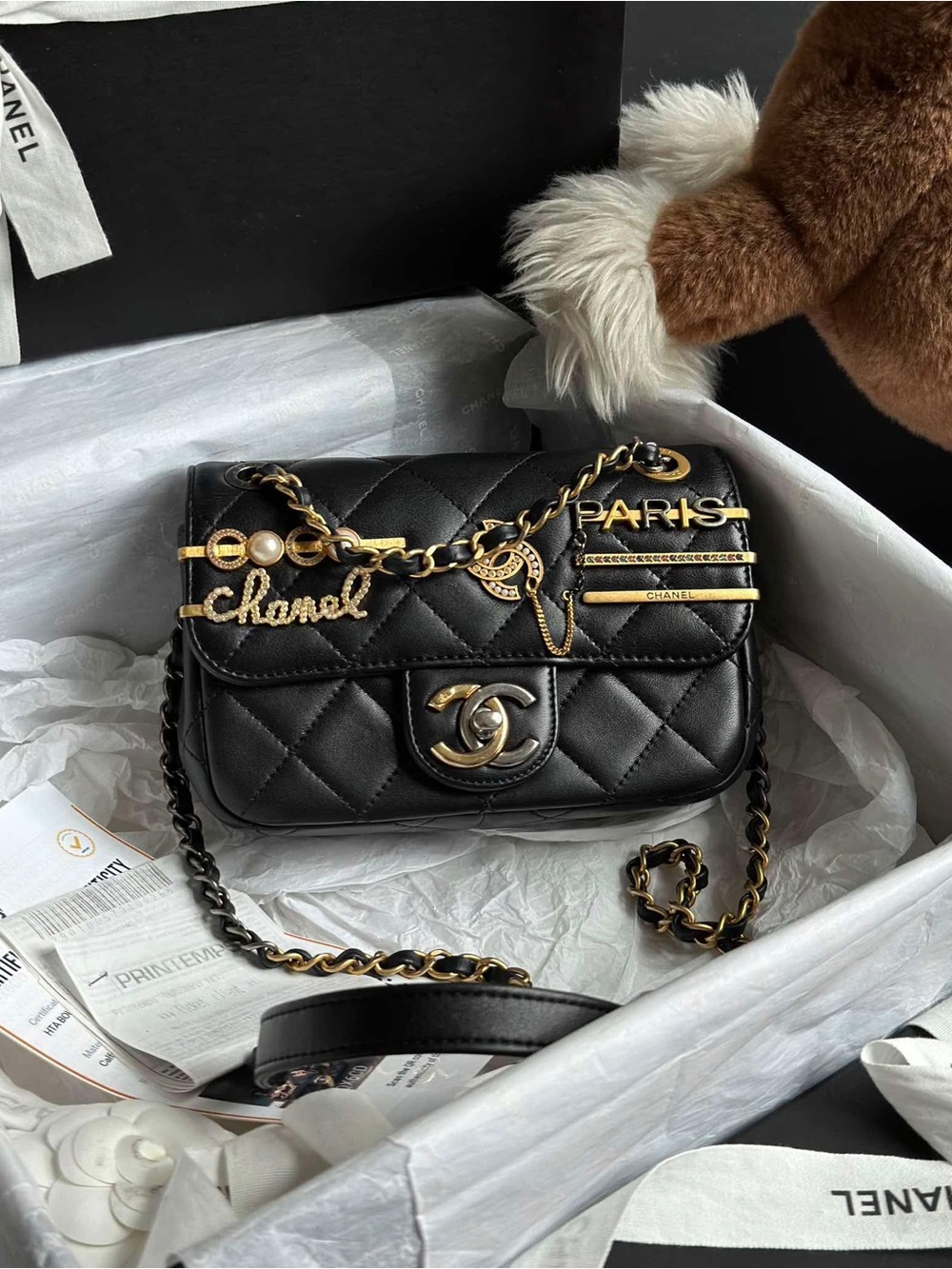 CHANEL Black Quilted Lambskin Mini Flap Bag with Gold Accents